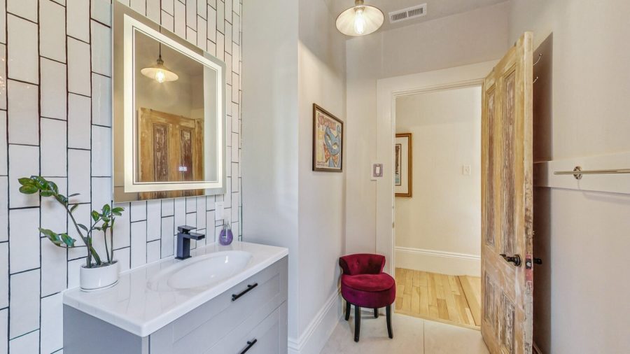 The hallway bathroom has been recently remodeled and has a standards sized shower stall with rainfall shower head.