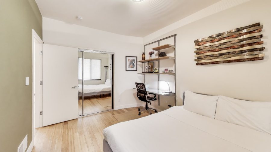 Bedroom with queen bed and laptop friendly desk