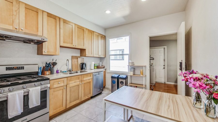 Well appointed kitchen with a dining table for 4.  We provide coffee, tea, sweeteners and dishwasher pods. (the 4th bedroom off the kitchen can be seen here)
