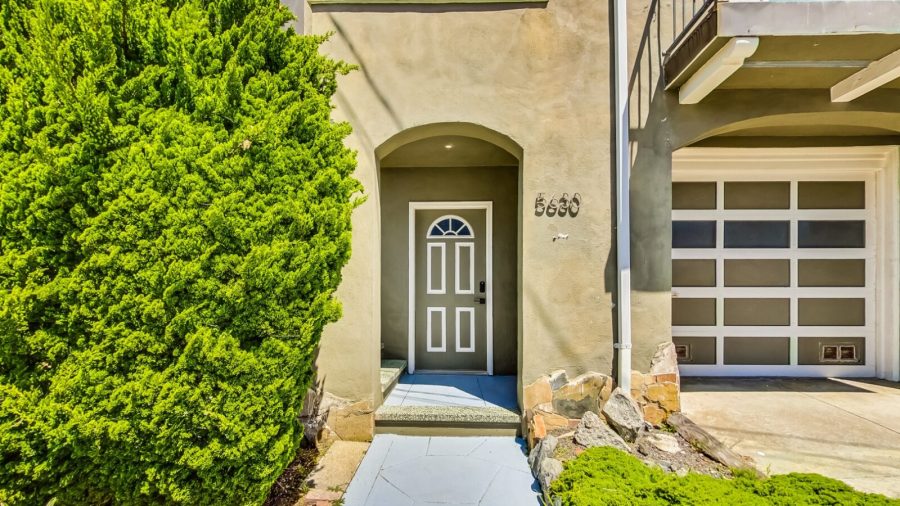 Entry from street--this door is to the laundry room.  the living space is upstairs.