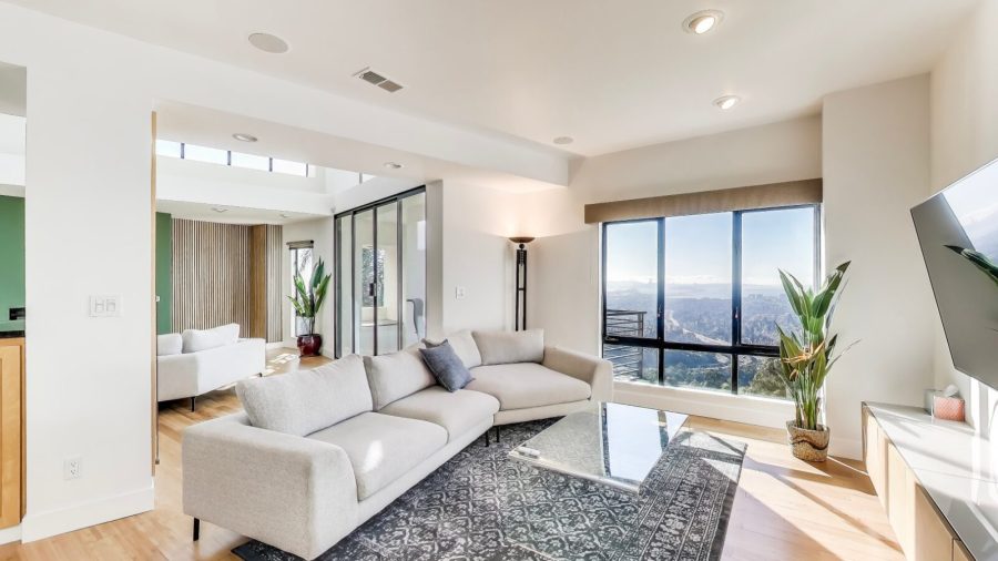 The family room has stunning views of the Bay as well as a 4K television with Youtube TV  service