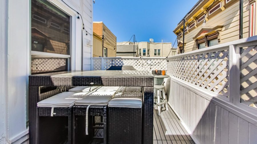 Outdoor terrace with BBQ grill seats 6... perfect for enjoying  warm days/evenings.  There's a slight view of downtown if you look hard enough...