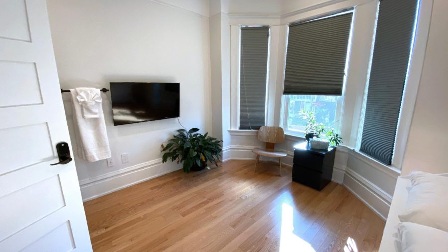 Business-ready room faces Castro St with DISH Network TV - need a desk? Just flip up the bed :-)