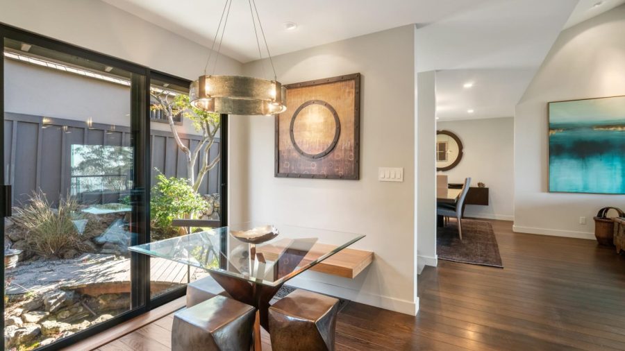 Breakfast nook in kitchen and dining room in the background