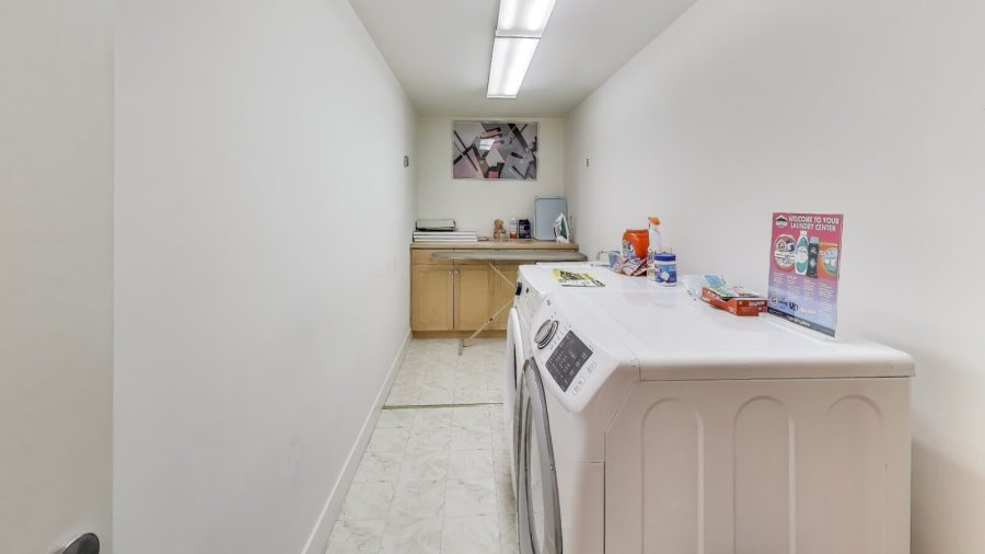 Laundry room with front loader washer & Dryer.  We provide Tide laundry detergent for your use.