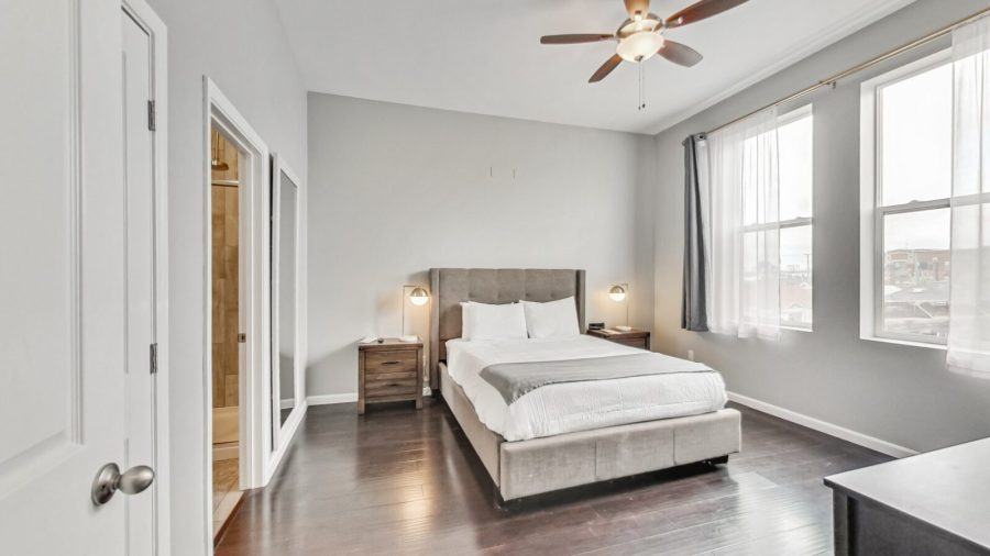 The master bedroom features a walk in closet, ensuite bathroom, and a Samsung smart TV with Airplay capabilities and streaming apps