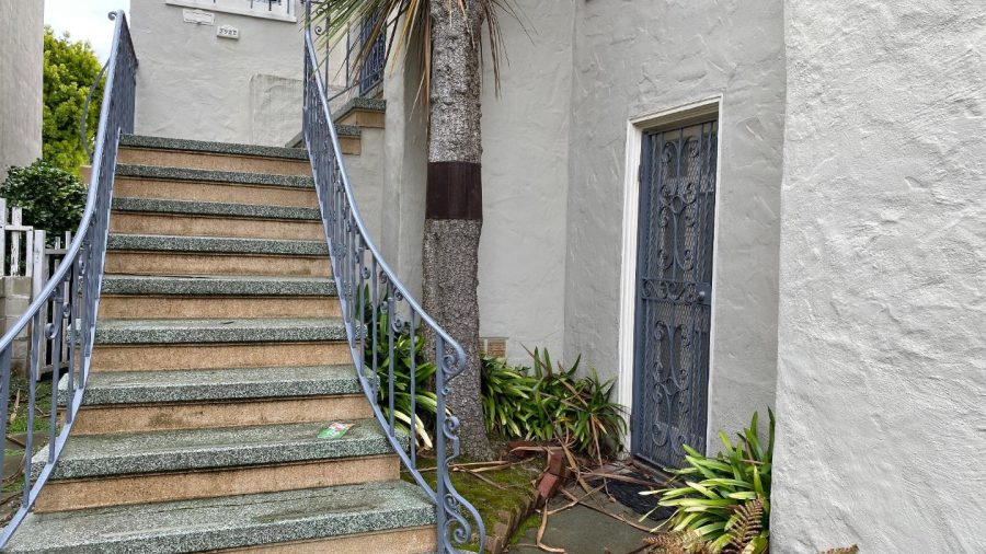 This is your entrance, next to the steps on the right...