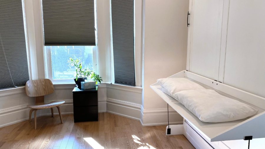 Business-ready room faces Castro St with DISH Network TV - need a desk? Just flip up the bed :-)