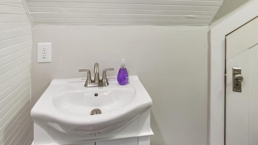 Upstairs hallway watercloset.  Upstairs has a full bathroom and a half bath so people don't have to wait for someone in the shower to brush teeth or other important business