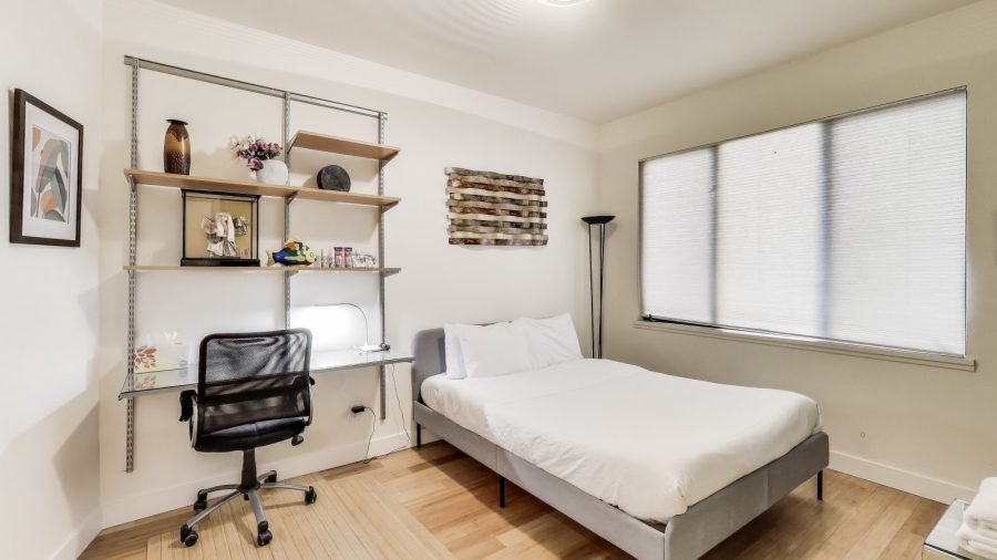 Bedroom with queen bed and laptop friendly desk
