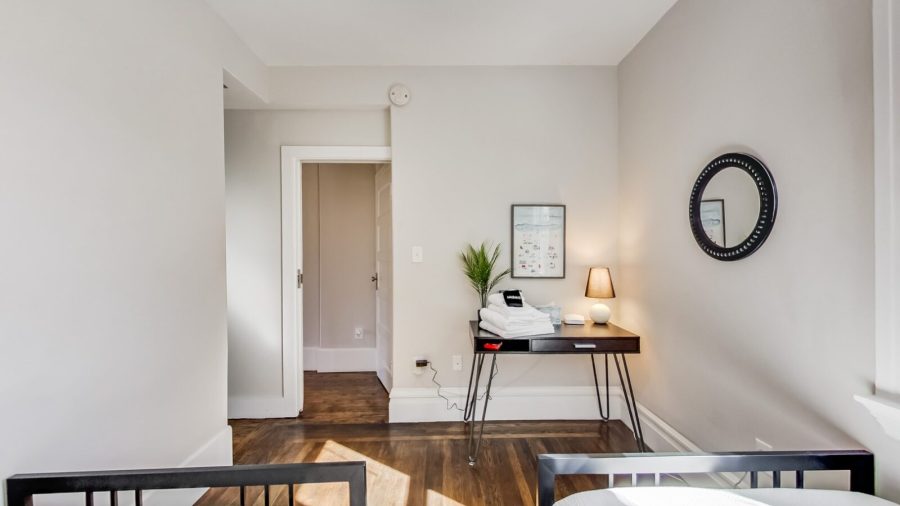 The back upstairs bedroom is just next to the bathroom and features two twin beds and a large closet