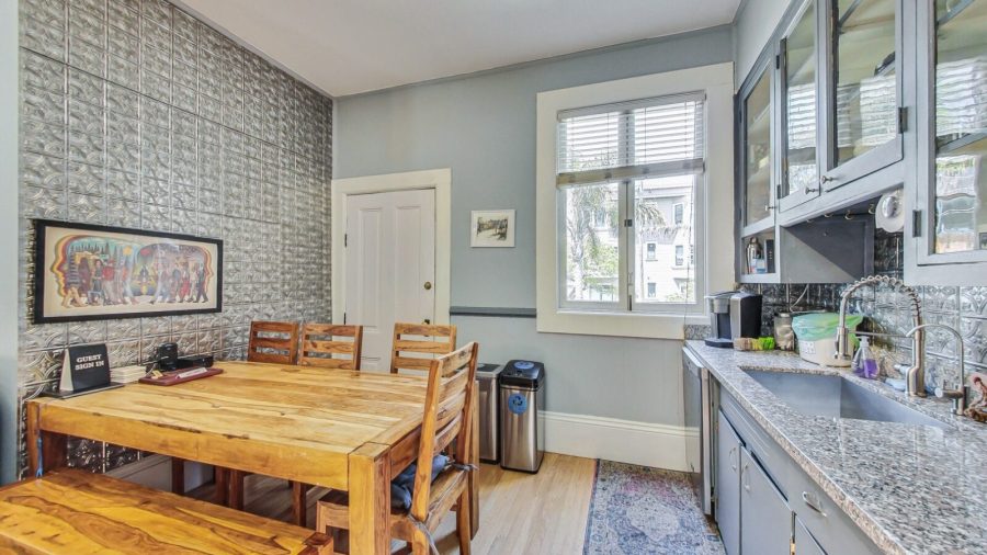 Dining table in the kitchen area (the laundry room is behind that door)