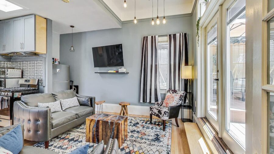 Spacious living room with television--you can watch the news or your own streaming service while cooking in the kitchen