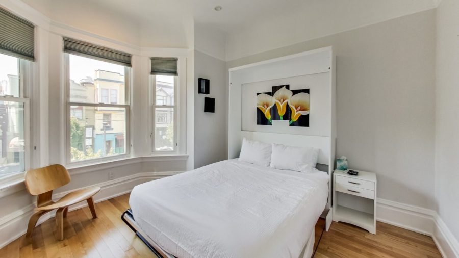 Business-ready room faces Castro St with DISH Network TV - need a desk? Just flip up the bed :-)