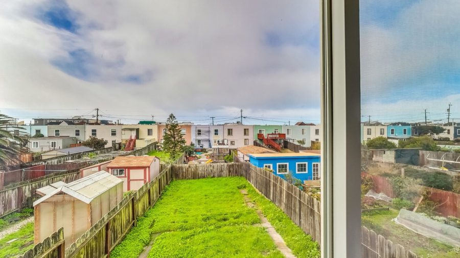 Yard view from third bedroom of the green back yard. (there is no access to the back yard)