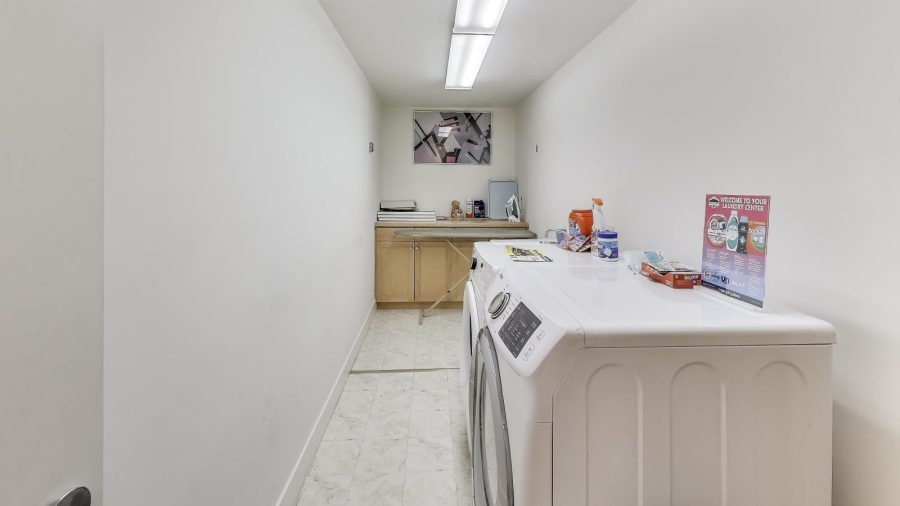 Laundry room with front loader washer & Dryer.  We provide Tide laundry detergent for your use.