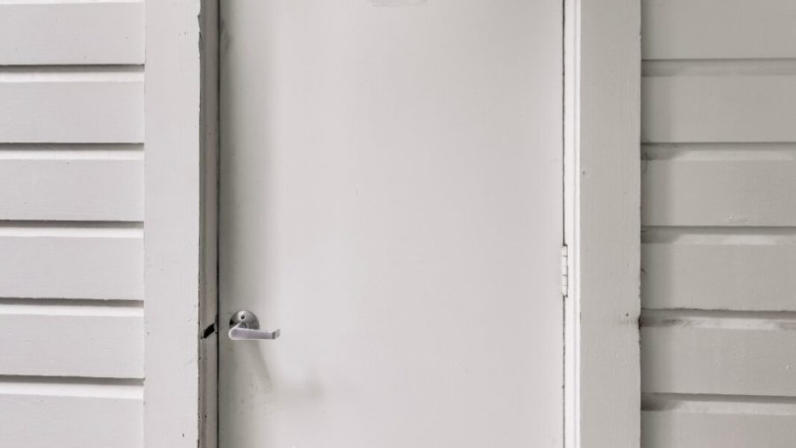 Enter the side door into the garage to access the studio