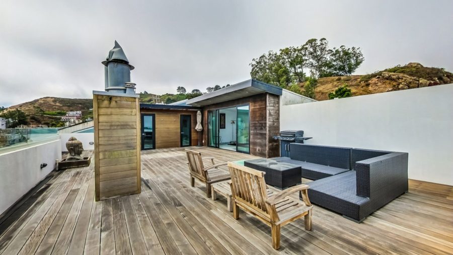 Rooftop deck with seating area, steam room, half bath and panoramic bay view.