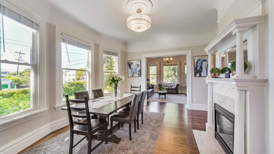 Spacious dining room with decorative fireplace and plenty of room for Eight people