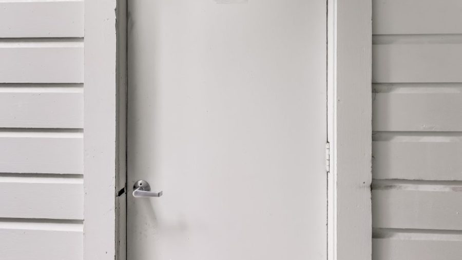 Enter the side door into the garage to access the studio