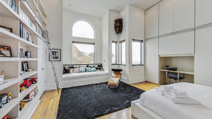 Main floor large bedroom with King bed, across from the shared bathroom. with a view of Tank Hill. 
