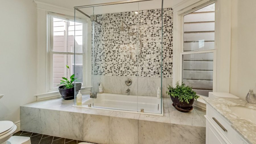 Inside the Master Bedroom Suite... Master bathroom with shower, tub and generously sized  double-sink vanity...
