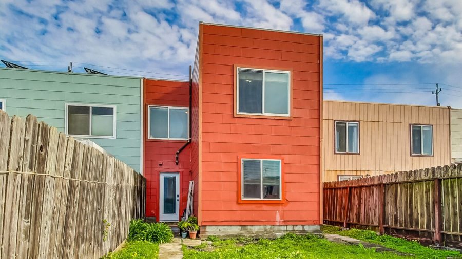 View of back of yard (first and third bedroom windows)
