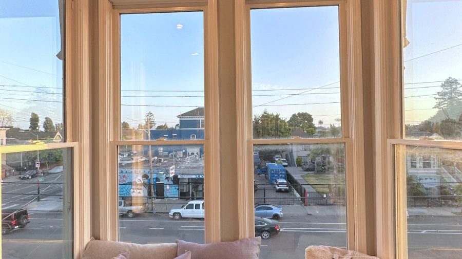The living room features a cozy bay window with ample light and sunshine; take a break in the sunshine or relax and read a novel