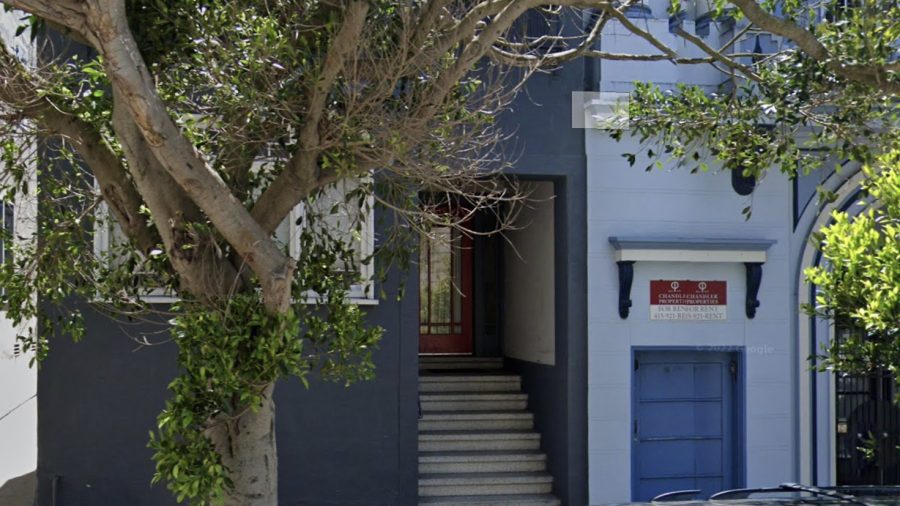 Front of Building.  There are about 8 steps up from the street to the main level.   Apartment is on the main level. Bedroom window is behind the tree in this photo