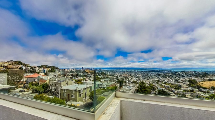 Rooftop deck with seating area, steam room, half bath and panoramic bay view.