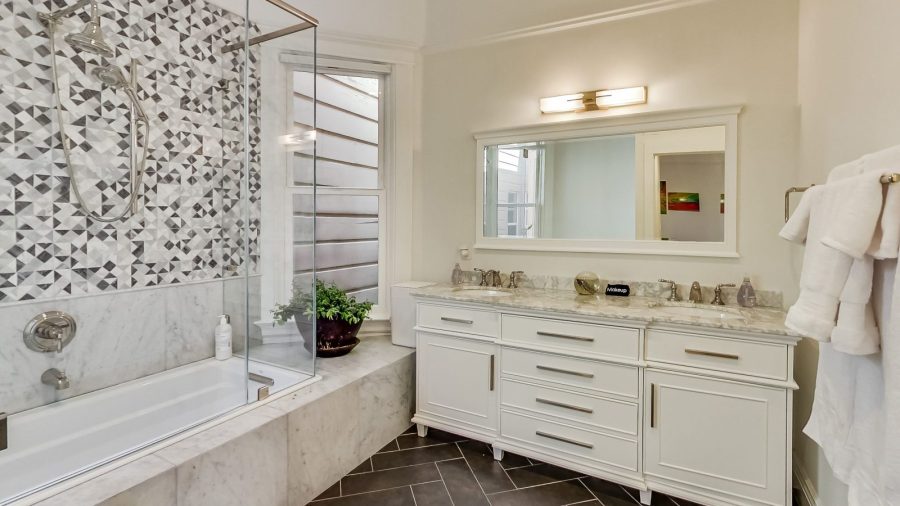 Inside the Master Bedroom Suite... Master bathroom with shower, tub and generously sized  double-sink vanity...