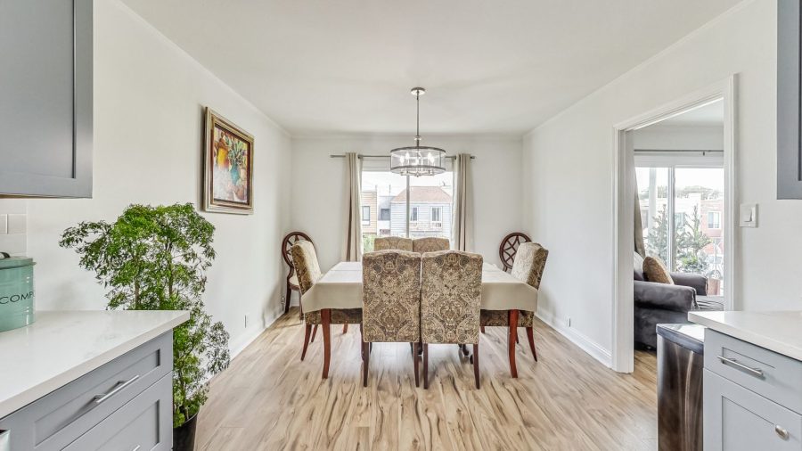 Dining area in upper level with open concept kitchen