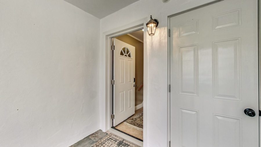Once inside the gate there is a door to go upstairs, which has 3 bedrooms and 1 bath and a door to the laundry room.