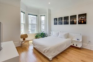 Large, bright and comfortable bedroom with queen-sized bed, view overlooking Castro St. and 18th, TV with Dish Network and Netflix...