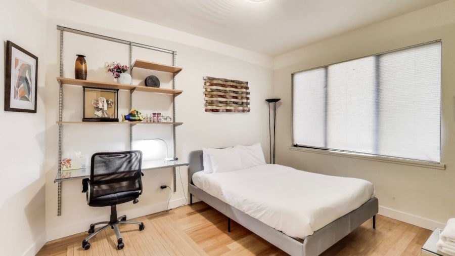 Bedroom with queen bed and laptop friendly desk