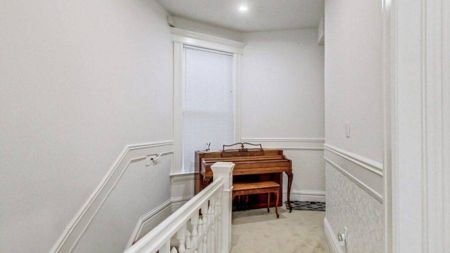 Hallway leads back to entry way or back to shared bathroom and kitchen.