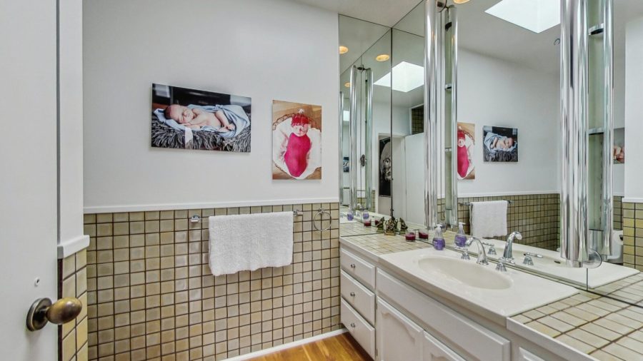 Main floor bathroom.  Large vanity and shower stall. 