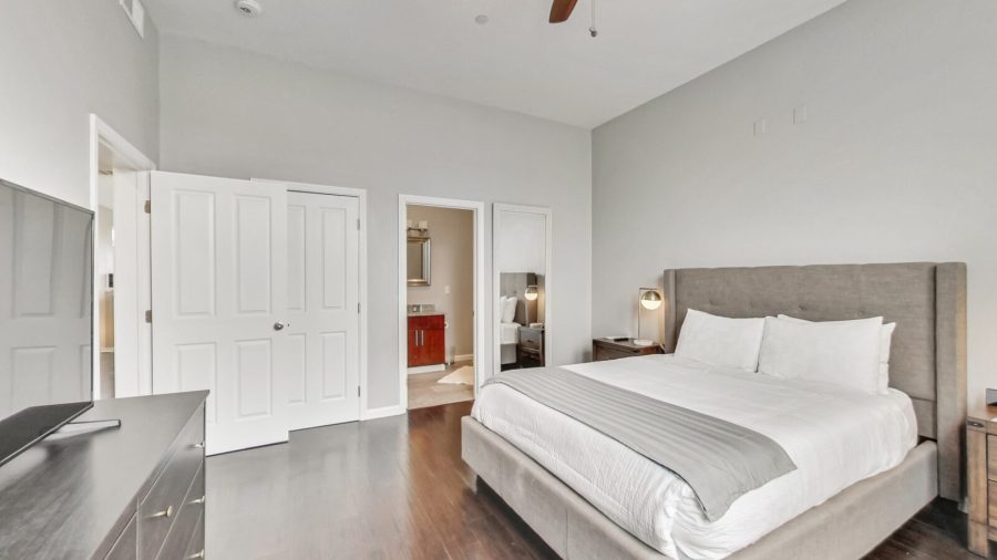 The master bedroom features a walk in closet, ensuite bathroom, and a Samsung smart TV with Airplay capabilities and streaming apps