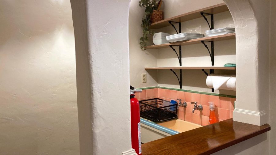 Kitchenette with sink, silverware and dishes...