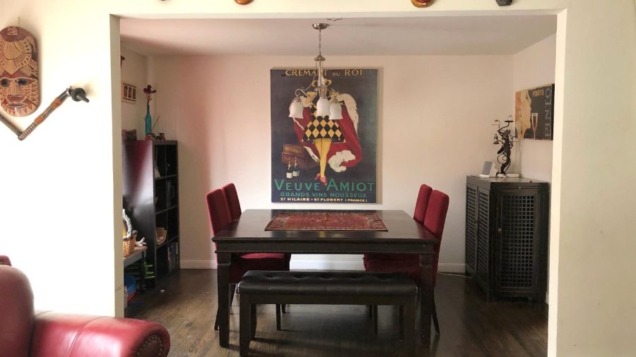 Living room with Projector and Apple TV, just pull the screen down from the top of the door frame to obscure the dining room and show the TV...