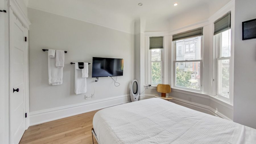 Business-ready smaller room also faces Castro St with DISH Network TV - need a desk? Just flip up the bed :-)