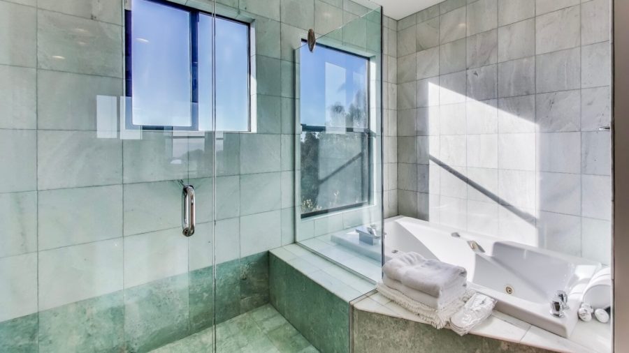 Master bathroom - Spa bath tub and glass enclosed shower with views of the Bay