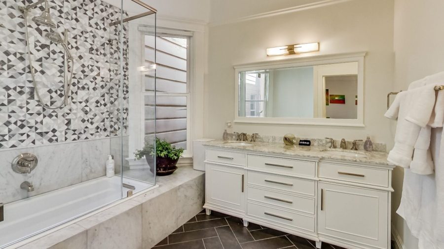 Inside the Master Bedroom Suite... Master bathroom with shower, tub and generously sized  double-sink vanity...