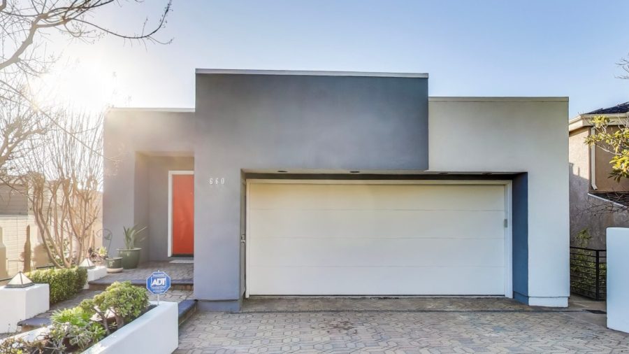 The driveway and entrance to the home.  You may park one car inside the garage or two cars in the driveway.
