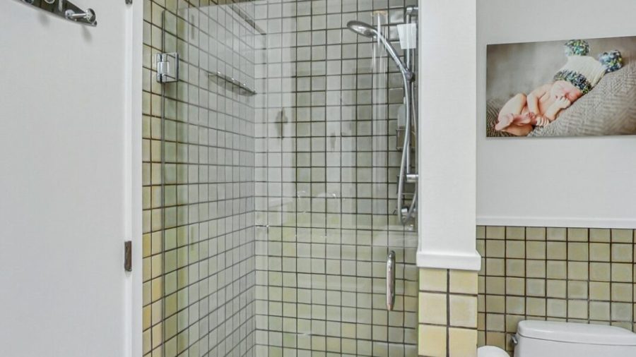Main floor bathroom.  Large vanity and shower stall. 
