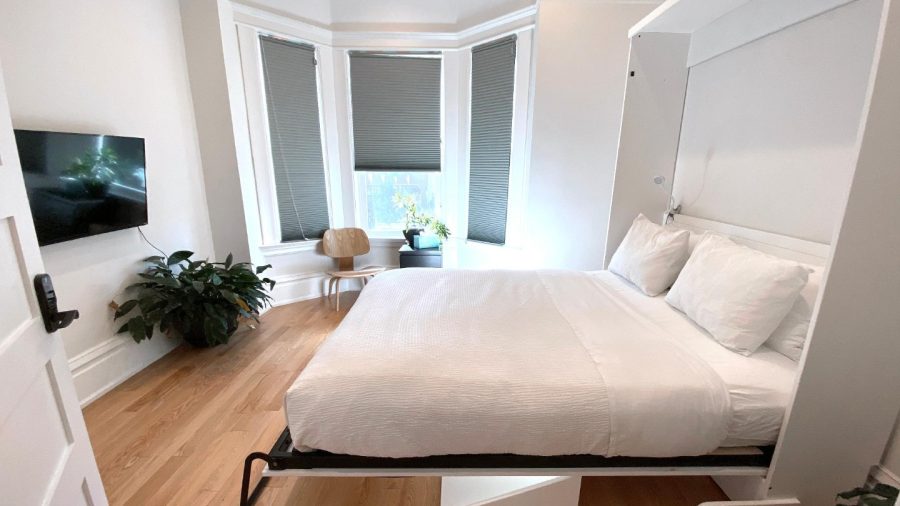 Business-ready room faces Castro St with DISH Network TV - need a desk? Just flip up the bed :-)