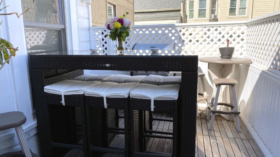 Outdoor terrace with BBQ grill seats 6... perfect for enjoying  warm days/evenings.  Shared area. There's a slight view of downtown if you look hard enough...