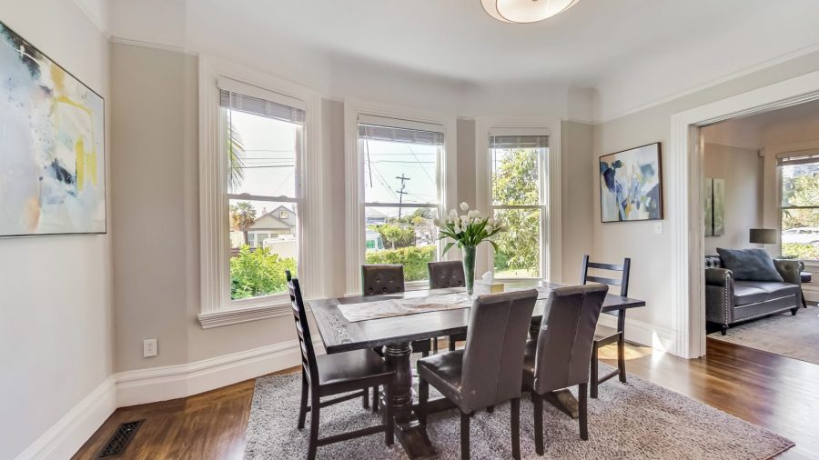 Spacious dining room with decorative fireplace and plenty of room for Eight people