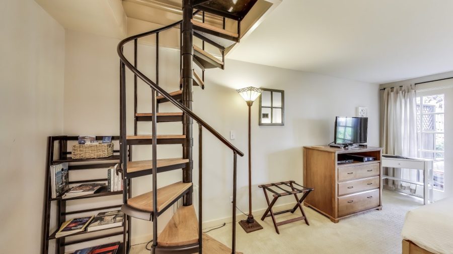 Cozy master suite.  
The spiral staircase leads to the main floor where your hosts live.  Please don't go up the stairs.