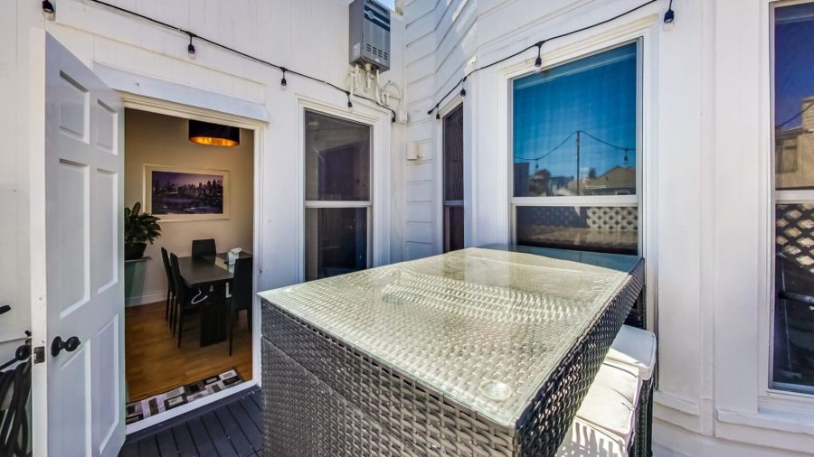 Outdoor terrace with BBQ grill seats 6... perfect for enjoying  warm days/evenings.  There's a slight view of downtown if you look hard enough...